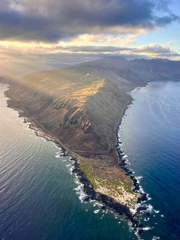 Aerial view of Kaena Point, a rugged peninsula at Oahu's westernmost tip at sunset