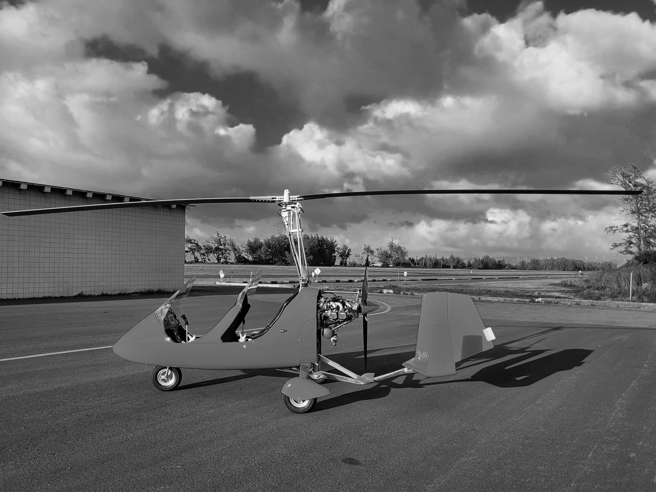 Open-cockpit gyroplane on the runway at Dillingham Airfield